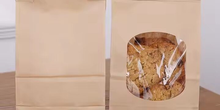 Kraft paper pouch with clear window and sealed closure for snacks and cookies